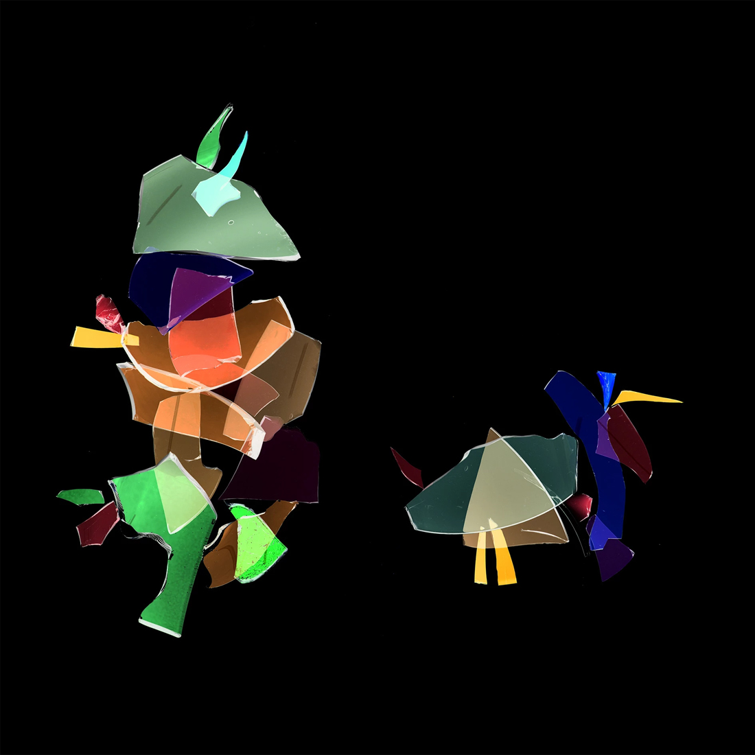 Abstrakti sommitelma särkyneistä värikkäistä lasinpaloista.